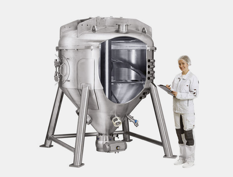 Operator standing along pharmaceutical mixer