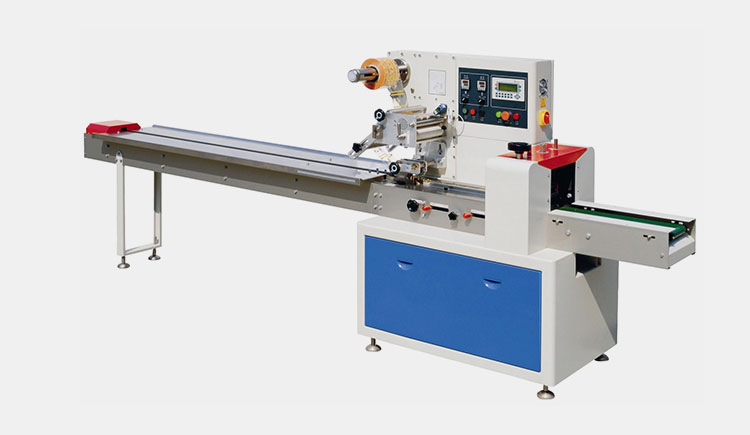 Flow wrapping machine