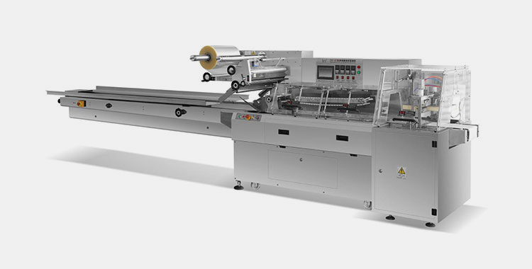 Flow wrapping machine